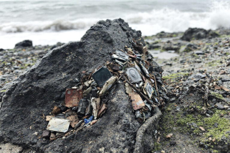Rock at Cumbria coast made from human waste and industrial slag.